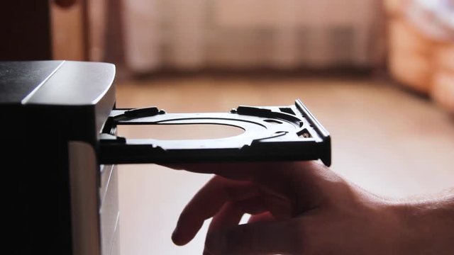 Inserting a blank CD or DVD into a laptop computer