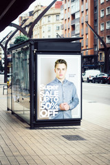 billboard super sale fashion  advertising on bus stop - obrazy, fototapety, plakaty