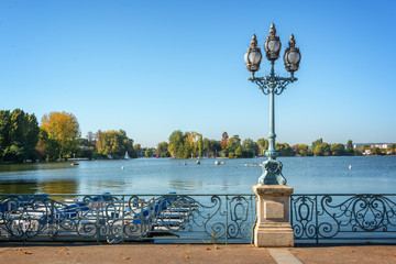 Old vintage street lamp on the lake of Enghien les Bains near Paris, France
