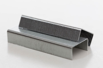 Stapler clips against a white background