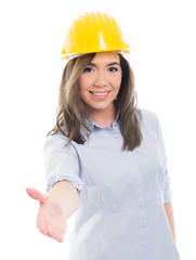 Portrait of female constructor offering hand shake.