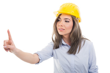 Portrait of female constructor sliding with index finger.
