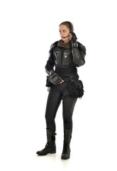 Fototapeta premium full length portrait of female soldier wearing black tactical armour, isolated on white studio background.