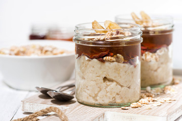 sweet oat pudding with jam and bananas, closeup