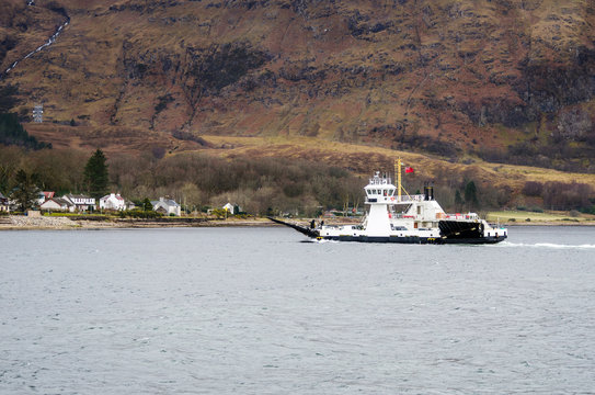 Ferry Crossing a Mountain Lake on a Winter Day