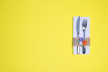 white napkin, knife and fork, place for dinner served in rustic style