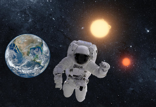 Astronaut in outer space over the planet earth. This image is a collage of different images furnished by NASA
