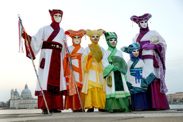 Family with beautiful costumes at the Carnival in Venice