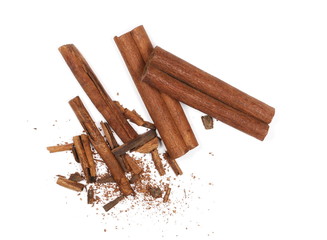 Cinnamon sticks with shavings isolated on white background, top view