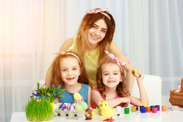 Obraz na płótnie Canvas Happy family preparing for Easter.