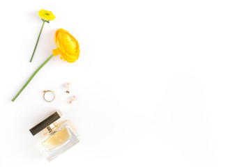 Romantic arrangement of perfume and flowers