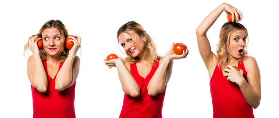 Beautiful blonde woman holding tomatoes