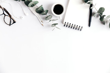 White table with coffee and notepad