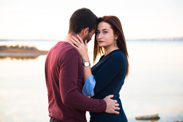 Fototapeta premium Young couple in love, man and girl in outdoor