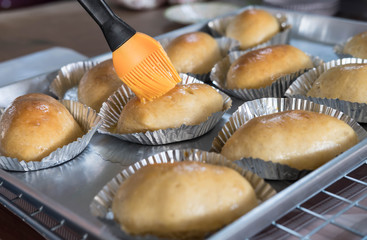 New breads  after baked from electric oven in tray on sieve