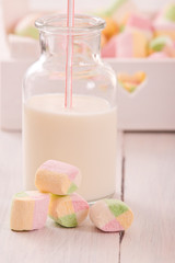 Marshmallows on wooden table. 