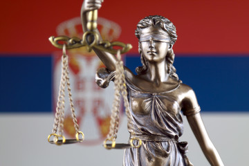 Symbol of law and justice with Serbia Flag. Close up.