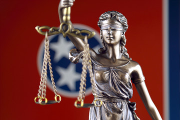 Symbol of law and justice with Tennessee State Flag. Close up.