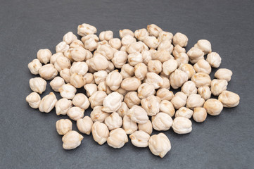 chickpea grains on black background