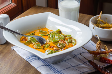 local food, milky pepper. fried green and red pepper in oil is cooked with milk.