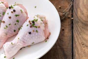 drumstick chicken on white plate

