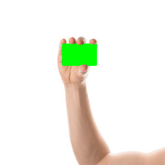 Male hand holds a two credit card or business card. Isolated with chroma key and all isolated on white background.