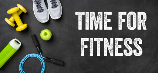 Fitness equipment on a dark background - Time for Fitness