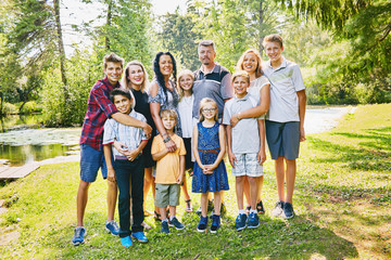 Portrait of happy parents embracing children