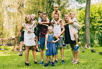 Adult siblings with little sisters and brothers