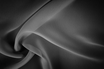 silk fabric is transparent, black and white. this material contains a coarser texture, a more rigid drapery and a slight peeping effect. We recommend using this fabric for your convenience.