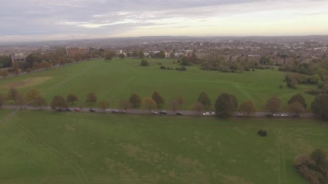 British City & Green Park Lined with Trees, Aerial Drone Footage