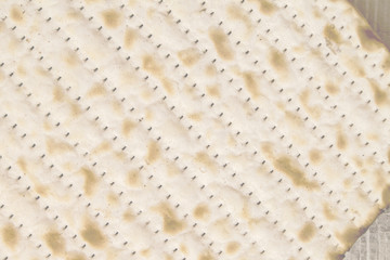 Texture of jewish passover matzah (unleavened bread) High Key image