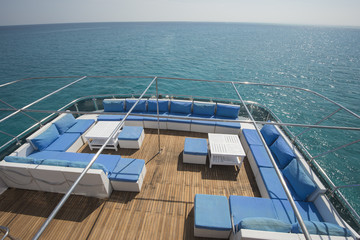 Fototapeta premium Table and chairs on deck of a luxury motor yacht