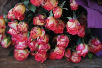 Beautiful bouquet of pink roses on the table 