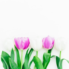 Floral composition with tulips flowers on white background. Flat lay, Top view.