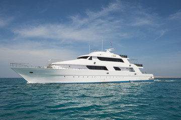 Fototapeta na wymiar Luxury private motor yacht sailing at sea