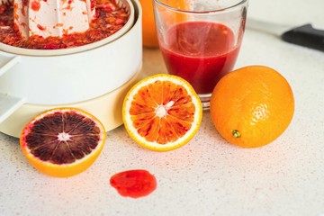 Preparing of red orange juice.