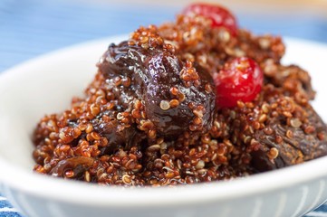 Quinoa dessert with dried plums and cherry.