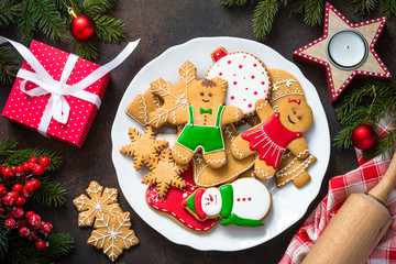 Christmas gingerbread in white plate top view.