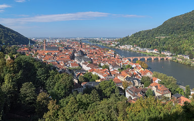 Fototapeta na wymiar View of Heidelberg Old Town with Jesuit Church, Church of the Holy Spirit and Old Bridge (Karl Theodor Bridge) across Neckar river in autumn sunny day, Germany