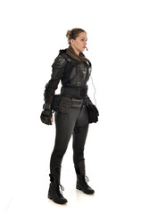 Fototapeta premium full length portrait of female soldier wearing black tactical armour, isolated on white studio background.