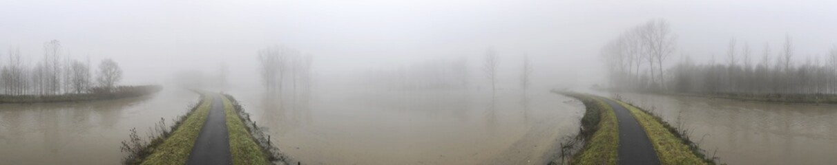 Panorama of biketrack at Provinciaal domein De Gavers in Geraardsbergen with the Dender river on the left side of the track and flooded meadows and forests on the right side of the image.