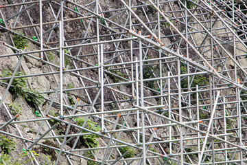 Construction of a stone wall. Steel scaffolding built on the stone walls of the fort. Reconstruction of the monument.