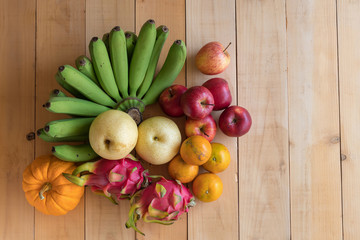 Fruits diet concept. different fruits on wooden table