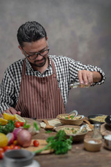 Man cook chef hipster with handsome bearded face