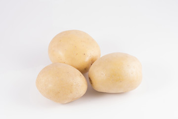 Some potatoes on a white surface