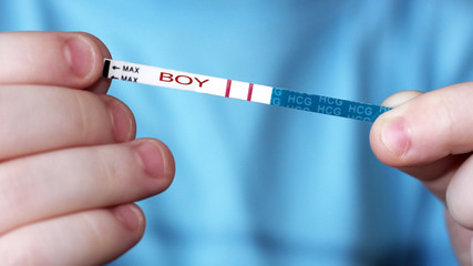 Pregnancy test in in children's hands