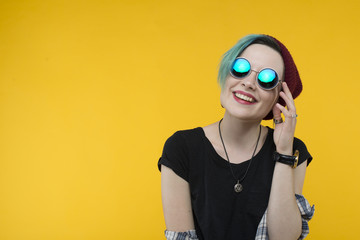 creative person style on yellow background. modern teenager. colour / colorful hairstyle