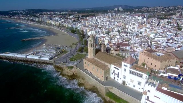 Flying over the city of Sitges. Aerial view