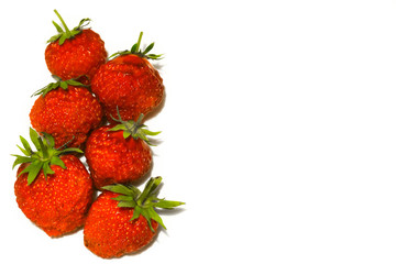 Six ripe strawberries isolated on a white background